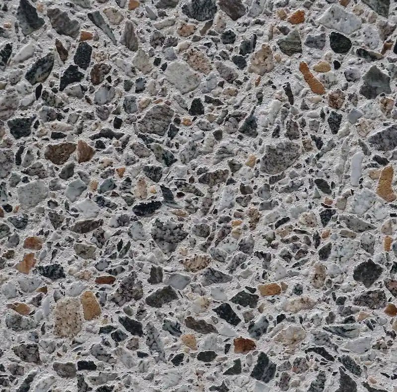 Détail texture minérale — grain et relief terrazzo
